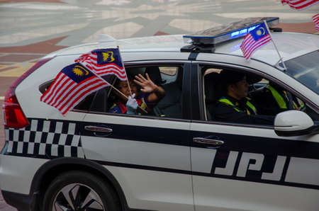 Dataran, Putrajaya/Malaysia - Aug 29 2018: JPJ car with Malaysia flag waving during procession.
