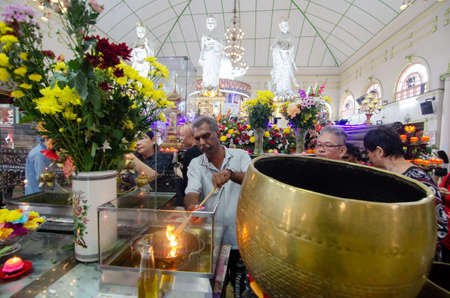 Georgetown, Penang/Malaysia - May 19 2019: Buddha devotees burn incense stick during pray Wesak day.