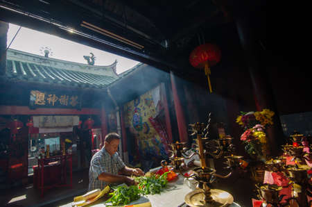 Georgetown, Penang/Malaysia - Apr 05 2019: Chinese devotees prepare the offering at Pek Kong Cheng temple.のeditorial素材