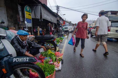 Bukit Mertajam, Penang/Malaysia - May 05 2019: Local go market shopping although raining day.のeditorial素材
