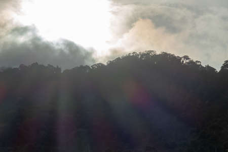 Sun light over the cloud and hill.
