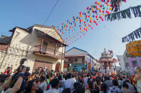 Georgetown, Penang/Malaysia - Jan 16 2014: Crowds wait to offering to silver chariot.