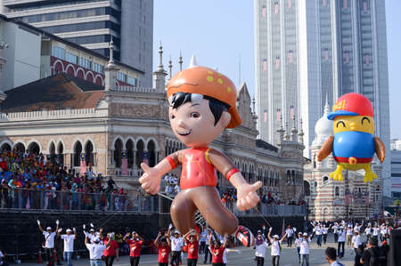 Dataran Merdeka, Kuala Lumpur/Malaysia - Aug 31 2015: Upin and Ipin join the Merdeka parade at...