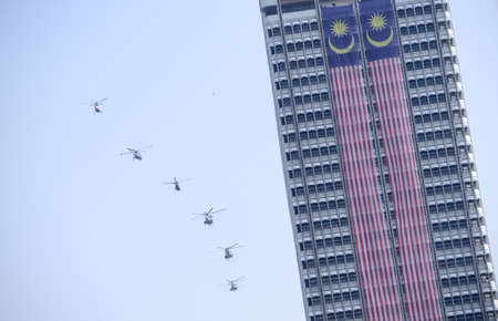 Dataran Merdeka, Kuala Lumpur/Malaysia - Aug 31 2015: Fighter jet fly pass Menara DBKL during...