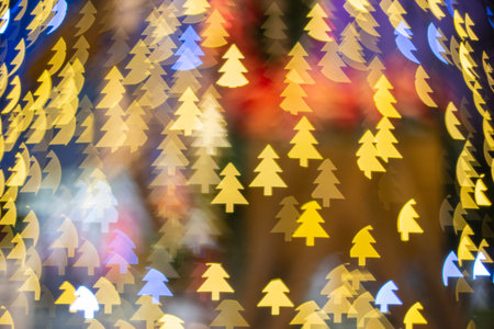 Blurry focus background of christmas tree symbol in led lightの写真素材