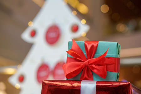 Close up wrapping gift box with ribbon