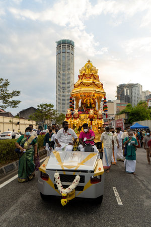 George Town, Penang, Malaysia - Jan 17 2022: Golden chariot pulled by car during procession Thaipusamのeditorial素材