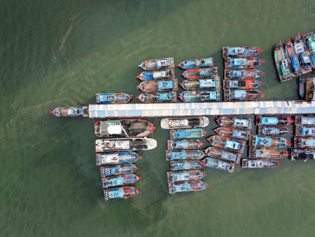 Batu Maung, Penang, Malaysia - Aug 30 2022: Aerial top down view fisherman boat park at jettyのeditorial素材