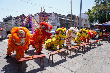 George Town, Penang, Malaysia - Jan 15 2022: Different color Chinese lion dance perform in hot sunny day at consecration ceremonyのeditorial素材