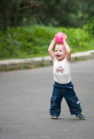 Little boy palying ball outdoorsの写真素材