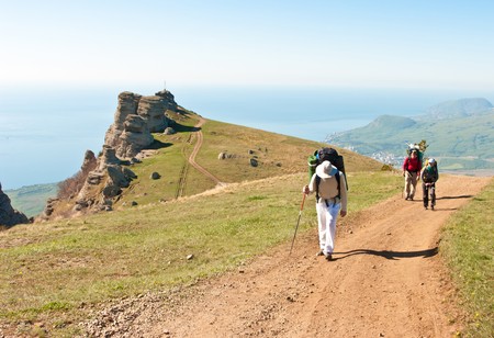 Team of travellersmoves forward n the mountainsの写真素材