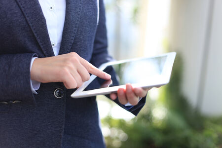 Business woman working with a digital tablet at modern officeの写真素材
