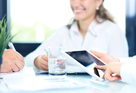 Business adviser analyzing financial figures denoting the progress in the work of the companyの写真素材
