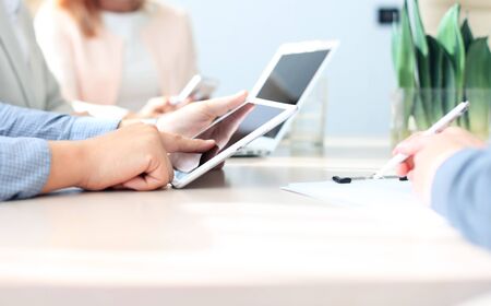 Business adviser analyzing financial figures denoting the progress in the work of the companyの写真素材