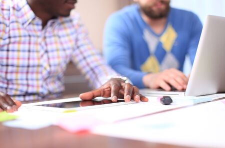 Business adviser analyzing financial figures denoting the progress in the work of the companyの写真素材