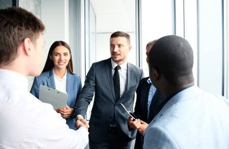 Business people shaking hands, finishing up a meetingの写真素材