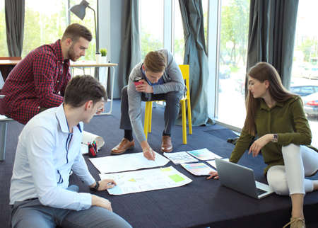 Group of young business people and designers. They working on new project. Startup concept.の写真素材