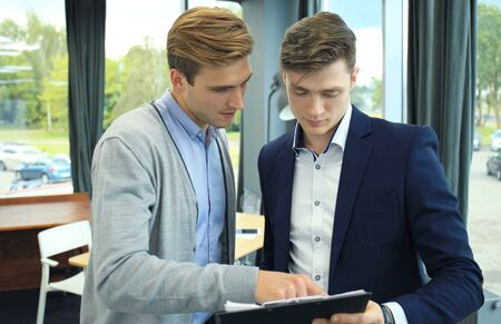 Two businessman dicussing business in the office.の写真素材