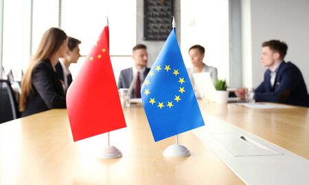 Diversity people talk the international conference partnership. Chinese flag and European union flag.の写真素材