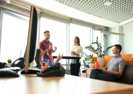 Group of young business people and designers. They working on new project. Startup concept.