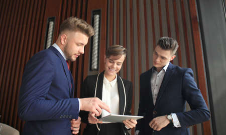 Group of buisness people working on tablet.の写真素材