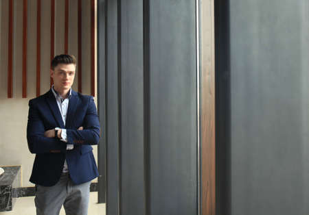 Portrait of smiling confident businessman in suit.の写真素材