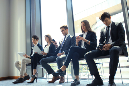 Stressful people waiting for the job interview.の写真素材
