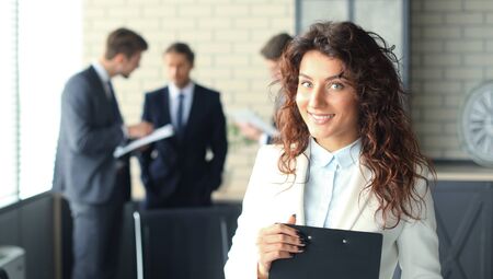 Face of beautiful woman on the background of business people