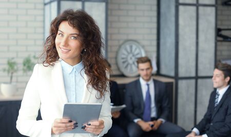 Face of beautiful woman on the background of business people