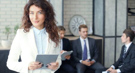 Face of beautiful woman on the background of business people