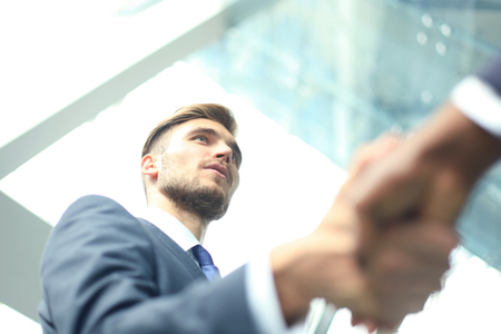 Business meeting. African American businessman shaking hands with caucasian businessman.の写真素材