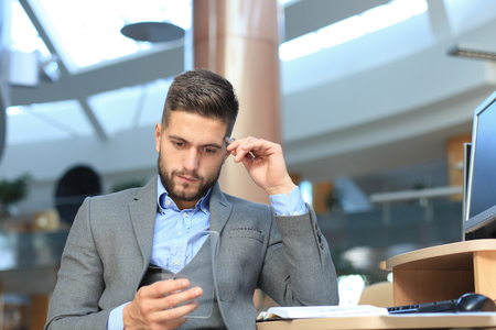Future concept. Businessman holds futuristic transparent smart phone.の写真素材