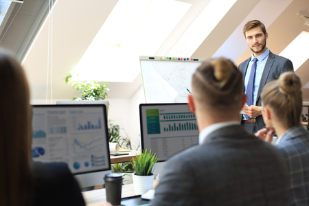 business conference presentation with team training flipchart officeの写真素材