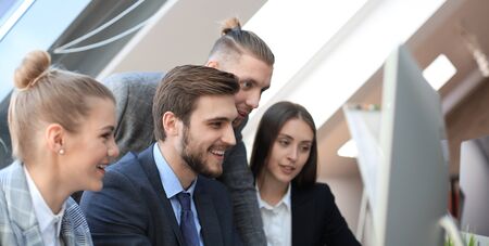 Group of business partners discussing strategies at meeting in officeの写真素材
