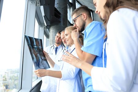 Group of doctors checking x-rays in a hospital