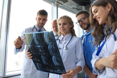 Group of doctors checking x-rays in a hospital