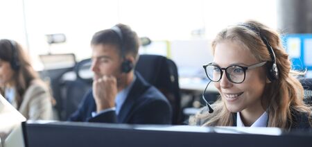 Female customer support operator with headset and smiling
