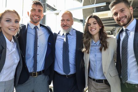 Group portrait of a professional business team looking confidently at camera