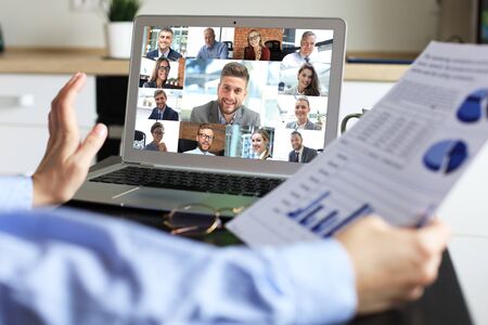 Woman speak talk on video call with colleagues on online briefing during self isolation and...