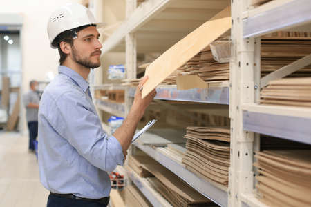 Portrait of a smiling warehouse keeper at workの写真素材