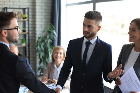 Business people shaking hands, finishing up a meeting