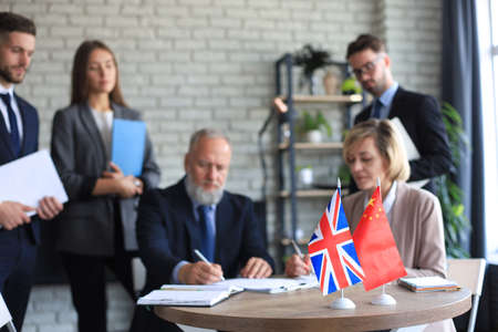 United Kingdom and Chinese leaders signing a document