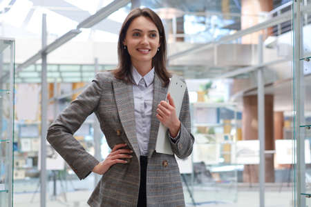 Attractive businesswoman standing in the office areaの写真素材