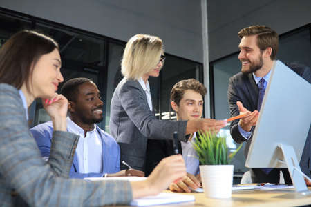 Modern business people discuss the new project at office