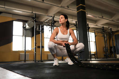 Sporty woman resting, having break after doing exercise