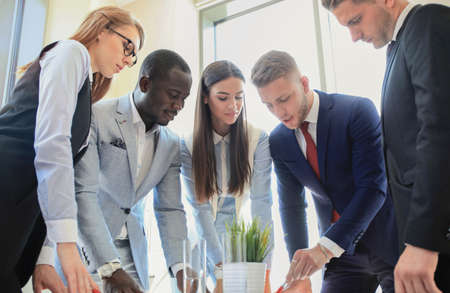 Business team discussing together business plans in officeの写真素材