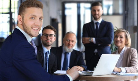 Portrait of a positive business employees at an office business meeting.の写真素材