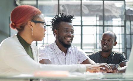 African business team on briefing, discussing ideas for new startup or project.