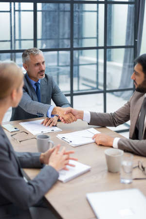 Business people shaking hands, finishing up a meeting
