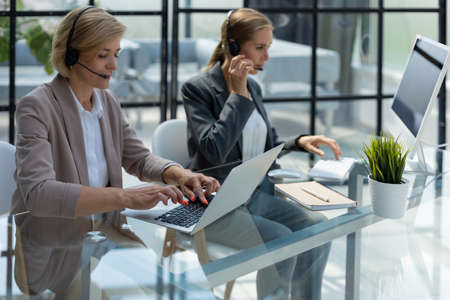 Female colleagues working in a call centerの写真素材